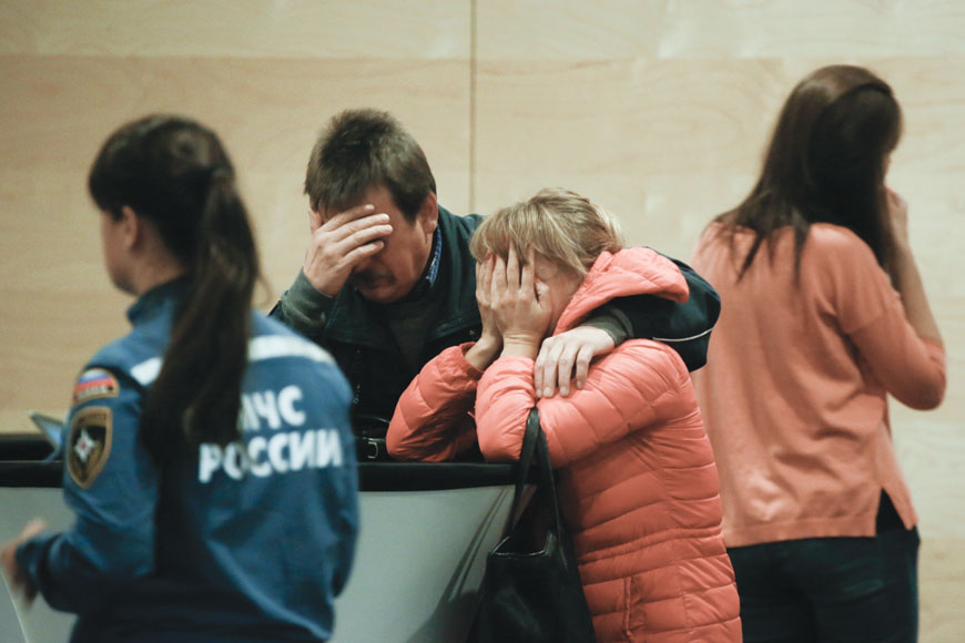 Relatives and friends of those on the Metrojet flight that crashed in Egypt react while gathering to grieve at a hotel near St Petersburg's Pulkovo Airport, outside St Petersburg, on  Saturday (AP photo)