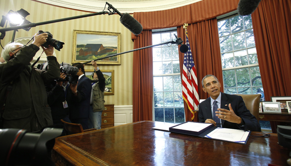 US President Barack Obama talks to the media before signing the Bipartisan Budget Act of 2015 in the Oval Office of the White House in Washington, DC, on Monday (AFP photo)