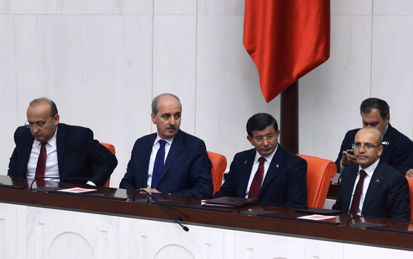 From left to right: Members of new Turkish Cabinet Deputy Prime Minister Yalcin Akdogan, Deputy Prime Minister Numar Kurtulmus, Turkish Prime Minister Ahmet Davutoglu and Deputy Prime Minister Mehmet Simsek, attend a session of the Turkish parliament in Ankara last week (AFP photo)
