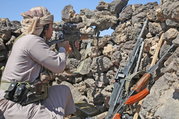 Armed Yemeni tribesmen from the Popular Resistance Committees, supporting forces loyal to Yemen's Saudi-backed President Abed Rabbo Mansour Hadi, monitor the area of Sirwah west of Marib city, on Sunday (AFP photo)