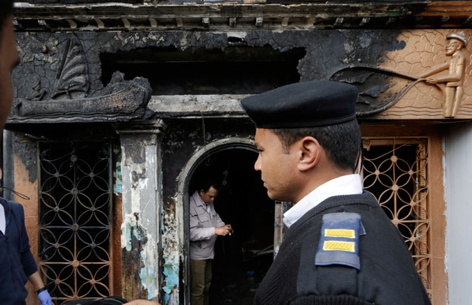 An Egyptian policeman stands in front a nightclub which was attacked in Cairo on Friday (AP photo)