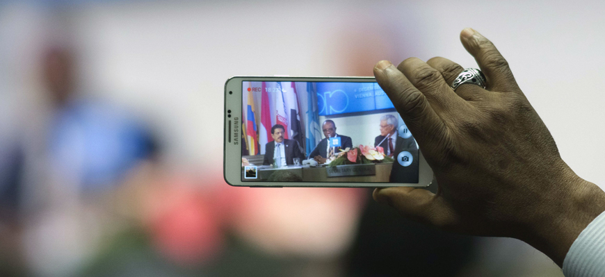 A journalist is recording with a smartphone Nigeria's Minister of State for Petroleum Resources and President of the OPEC Conference Emmanuel Ibe Kachikwu and OPEC's Secretary General Abdullah Salem Al Badri of Libya speaking during a news conference after a meeting of the Organisation of the Petroleum Exporting Countries (OPEC) at OPEC headquarters in Vienna, on Friday (AFP photo)