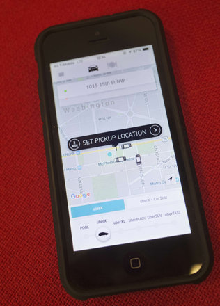 A December 18 photo shows the Uber application running on a smartphone in Washington, DC (AFP photo by Mandel Ngan)
