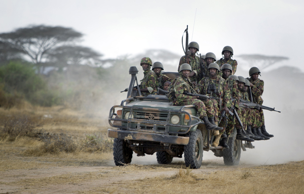 In this February  20, 2012 file photo, Kenyan soldiers ride on a vehicle at their base in Tabda, inside Somalia (AP photo)