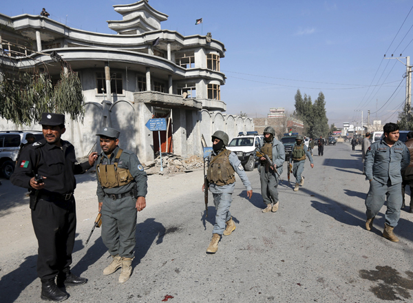 Afghan policemen arrive at the site of a suicide attack in Jalalabad, Afghanistan, on Thursday (Reuters photo)