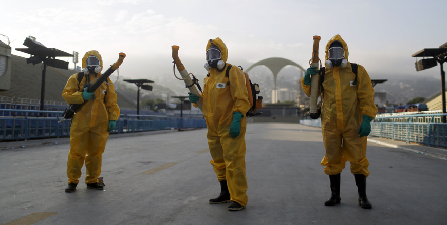 Municipal workers wait before spraying insecticide at Sambodrome in Rio de Janeiro, Brazil, on Tuesday (Reuters photo)