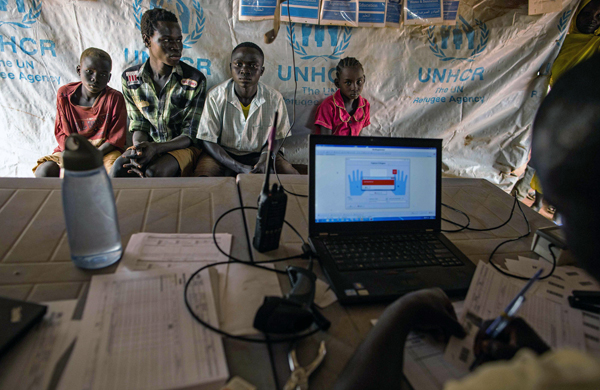 A group of children from South Kordofan, Sudan, waits to be registered as they arrive at a refugee settlement in Yida, South Sudan, on Monday (AFP photo)