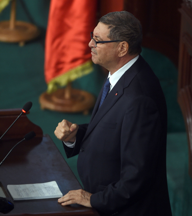 Tunisian Prime Minister Habib Essid gives a speech during a plenary session at the parliament in Tunis to discuss the ongoing wave of social unrest in Tunisia, on Wednesday (AFP photo)