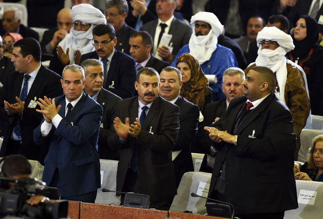 Algerian parliamentary group leaders applaud during a vote on a package of constitutional reforms on Sunday in the capital Algiers (AFP photo)