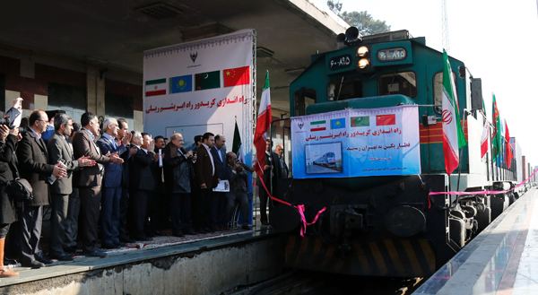 Iranian officials applaud on the platform as the first train connecting China and Iran arrives at Tehran Railway Station on Monday (AFP photo)
