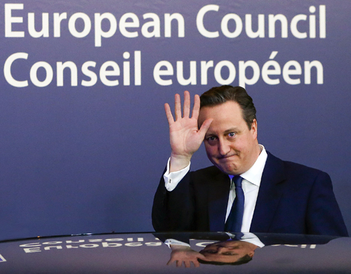 British Prime Minister David Cameron waves as he leaves a European Union leaders summit in Brussels, on Thursday (Reuters photo)