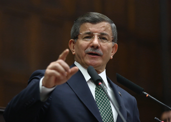 Turkish Prime Minister Ahmet Davutoglu addresses his lawmakers in Ankara, Turkey, on Tuesday (AP photo)