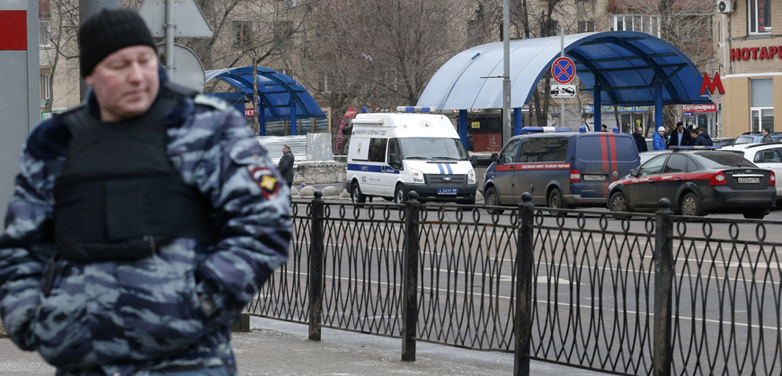 A Russian police officer stands at the site where a woman suspected of murdering a young child was detained, near Oktyabrskoye Pole metro station in Moscow, Russia, on Monday (Reuters photo)