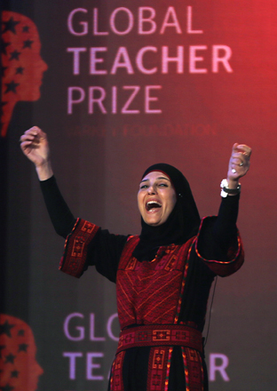 Palestinian primary school teacher Hanan Al Hroub reacts after she won the second annual Global Teacher Prize in Dubai, United Arab Emirates, on Sunday (AP photo)