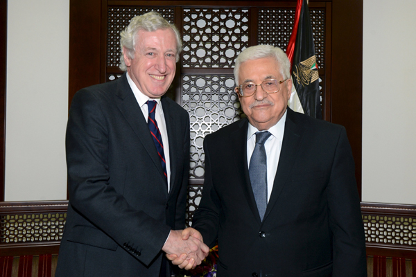 Palestinian President Mahmoud Abbas shakes hands with French special envoy Pierre Vimont (left) before their meeting, in the West Bank city of Ramallah, on Tuesday (Reuters photo)