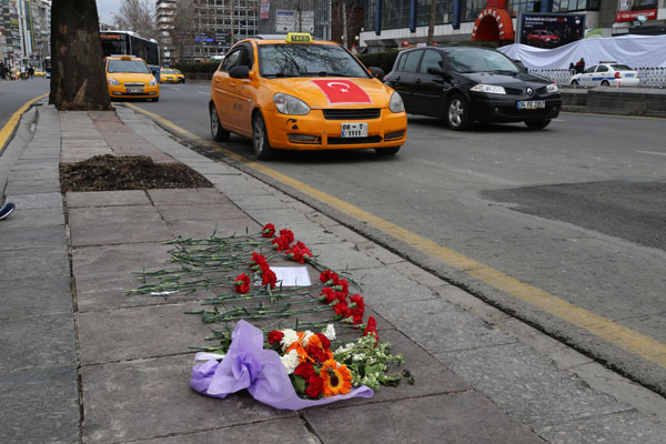 Flowers left by local people are seen at Sunday’s explosion site in Ankara, Turkey, Tuesday (AP photo)