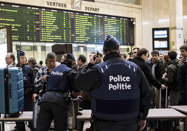Police search passenger bags at the Central Station in Brussels on Wednesday (AP photo)