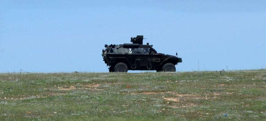 A Turkish army armed vehicle patrols as Kurdish people celebrate the birthday of jailed Kurdish Worker Party’s founder Abdullah Ocalan on Monday in his hometown of Omerli in Sanliurfa province, southeastern Turkey (AFP photo)