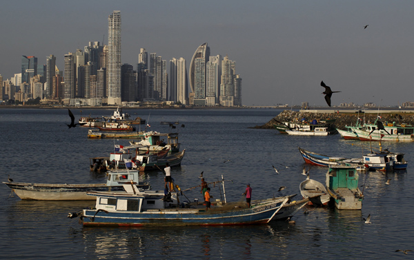 Fishermen work on a boat in Panama City, on Monday. Panama City has found itself the centre of global media attention following a data leak scandal (Reuters photo)