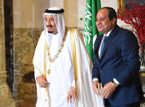In this picture taken Friday,, provided by the office of the Egyptian presidency, Egyptian President Abdel Fattah Al Sisi (right)  stands with Saudi Arabia’s King Salman in Cairo (AP photo)