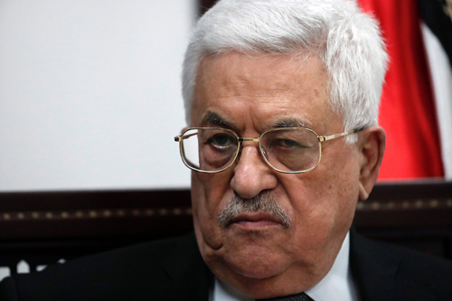 Palestinian President Mahmoud Abbas listens during an exclusive interview with AFP reporters in his office in the West Bank city of Ramallah on Monday (AFP photo)