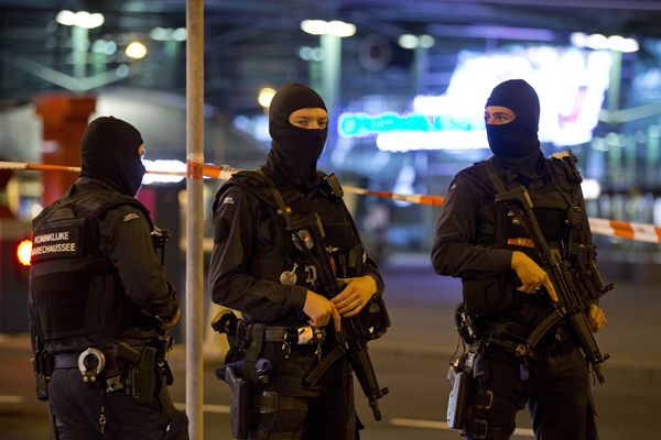 Hooded military police officers guard a part of Schiphol Airport in Amsterdam, Netherlands, on Wednesday (AP photo)
