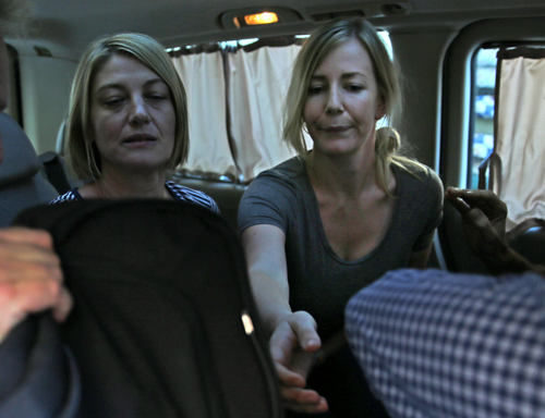 Australian TV journalist Tara Brown (left) and Sally Faulkner (right), the mother of the two Australian children, sit in a minivan after they were released from a Lebanese jail with the three members of Channel 9 Australian TV crew, in Baabda east of Beirut, Lebanon, on Wednesday (AP photo)