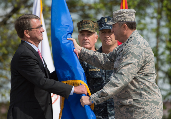 US Secretary of Defence Ashton Carter (left) receives the rank pennant from US Air Force General Philip Breedlove, the outgoing commanding officer of US and NATO troops in Europe, during the change in command at the United States European Command, in Stuttgart, Germany, on Tuesday (AP photo)