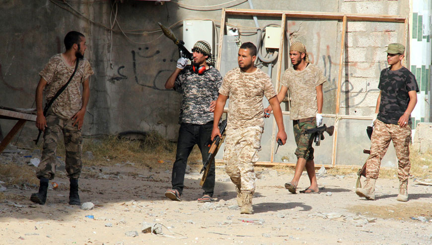Forces loyal to Libya's UN-backed unity government patrol the city of Sirte, 450 kilometres east of Tripoli, during an operation to recapture the city from Daesh militants, on Sunday (AFP photo)