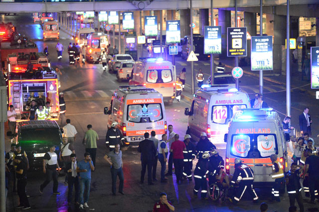 Paramedics help casualties outside Turkey's largest airport, Istanbul Ataturk, Turkey, following a blast, on Tuesday (Reuters photo)