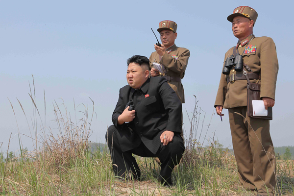North Korean leader Kim Jong-un guides the multiple-rocket launching drill of women’s sub-units under KPA Unit 851, in this undated photo released by North Korea’s Korean Central News Agency, on April 24, 2014 (Reuters file photo/KCNA)