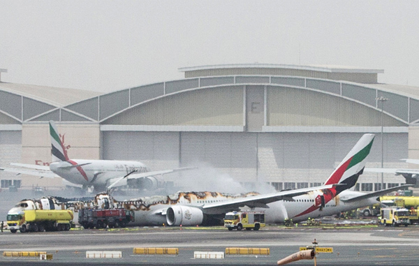 An Emirates Airline flight is seen after it crash-landed at Dubai International Airport, the UAE, Wednesday (Reuters photo)