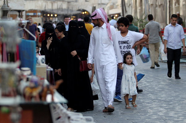 People shop at Souq Waqif market in Doha, Qatar, on Tuesday (Reuters photo)