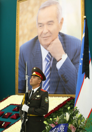 An honour guard stands near a portrait of Uzbek President Islam Karimov during a mourning ceremony following Karimov’s death, in Samarkand, Uzbekistan, on Saturday (Reuters photo)
