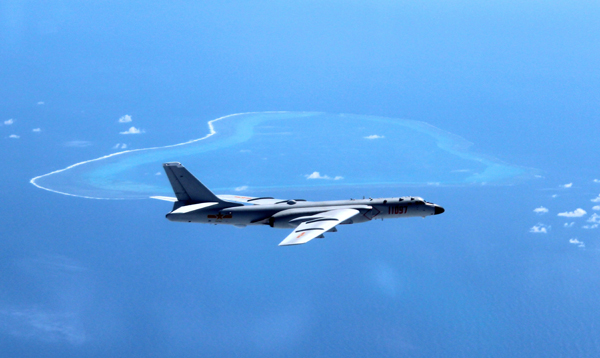 In this undated file photo released by Xinhua News Agency, a Chinese H-6K bomber patrols the islands and reefs in the South China Sea (AP photo)