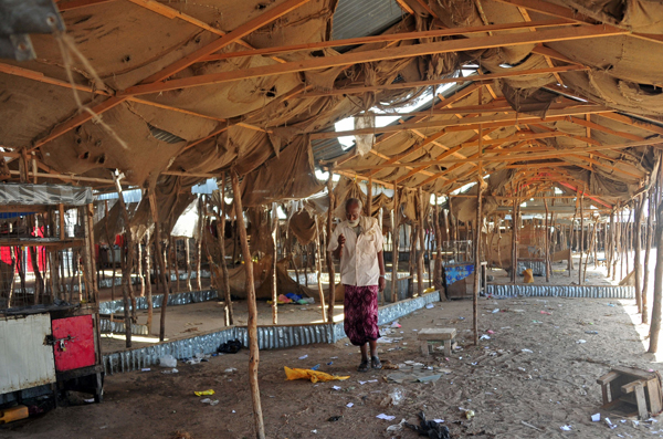 A man walks among the empty spaces for stalls in the Miraa market in Mogadishu, on Wednesday, following an import ban on miraa, also known as khat, annouced by the Somalian government earlier in the week (AFP photo)