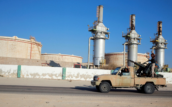 Libyan forces loyal to eastern commander Khalifa Haftar ride a pickup truck at the Zueitina oil terminal in Zueitina, west of Benghazi, Libya, on September 14 (Reuters photo)