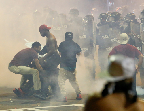 People manoeuvre amongst tear gas in uptown Charlotte, NC, during a protest of the police shooting of Keith Scott in Charlotte, North Carolina, US, on  Wednesday (Reuters photo)