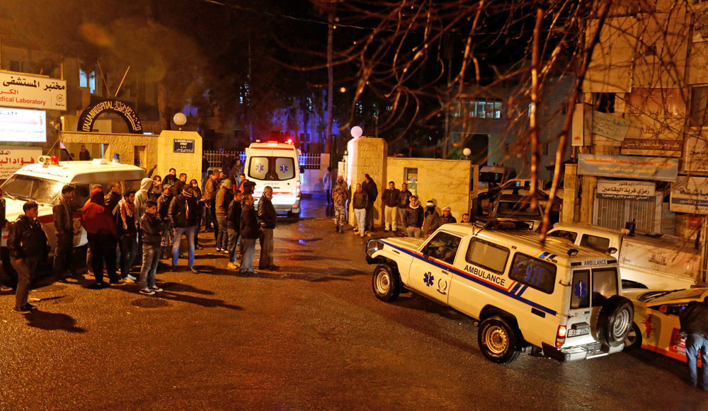 Ambulances are seen in front of the Italian hospital, where some of the injured were evacuated to after a terror attack, in the city of Karak, on Sunday (Reuters photo)
