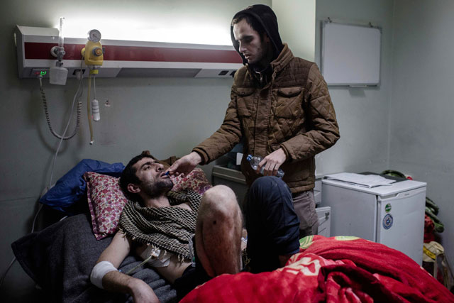 In this Wednesday photo, Manhal Ahmed lies in a hospital bed at West Emergency Hospital in Erbil, Iraq (AP photo)