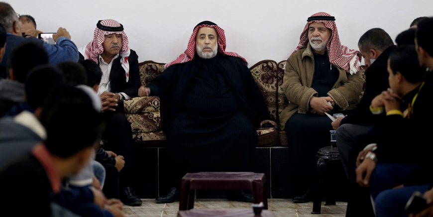 Suleiman Saed (centre), a relative of Anwar Abu Zaid, speaks to the media in Amman on Tuesday (AP photo by Raad Adayleh)