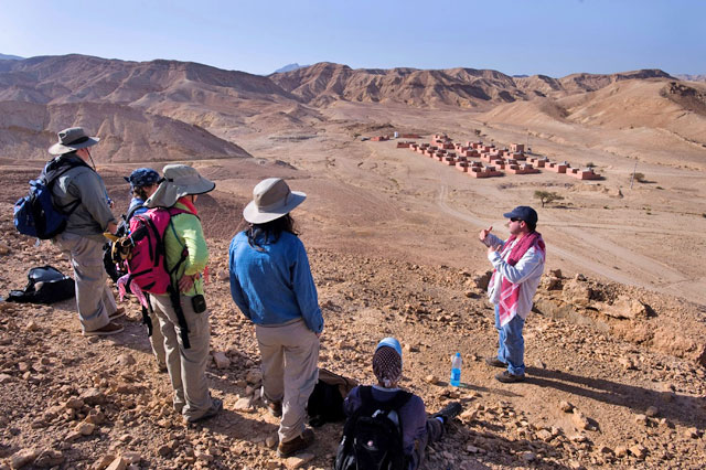 Andrew Smith II addresses a group of researchers in front of Bir Madhkur site, recently (Photo courtesy of Andrew Smith II)