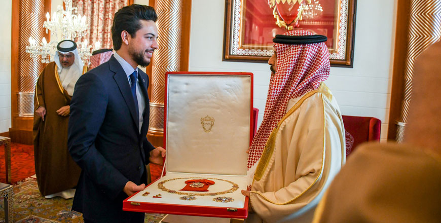 HRH Crown Prince Hussein receives the King Hamad Order of the Renaissance of the First Class from Bahraini King Hamad Bin Isa Al Khalifa in Manama on Tuesday (Photo courtesy of Royal Court)