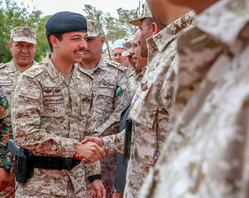 HRH Crown Prince Hussein attends the graduation ceremony of participants in the first phase of the National Service programme on Thursday in the Royal Military College field (Petra photo)