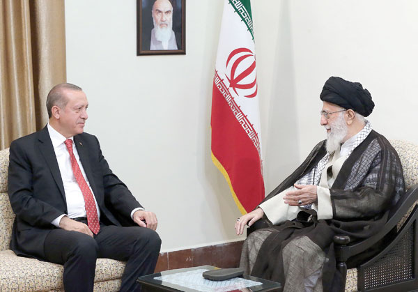 A handout photo provided by the office of Iran’s Supreme Leader Ayatollah Ali Khamenei shows him (right) meeting with Turkish President Recep Tayyip Erdogan in Tehran, on Wednesday (AFP photo)