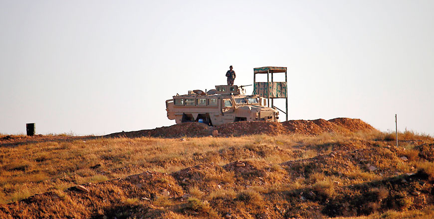 A Jordanian soldier keeps watch at the border between Syria and Jordan on Monday  (AFP photo)