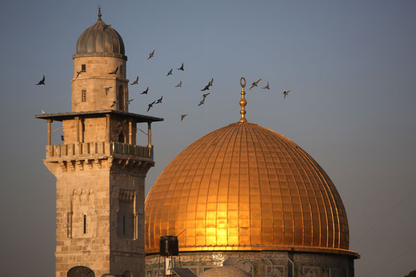 Birds fly around the Dome of the Rock in Al Haram Al Sharif in Jerusalem's old city on Friday (AFP photo)