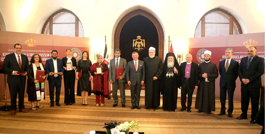 His Majesty King Abdullah poses for a group photo with recepients of the 'King Abdullah II of Jordan Prize for World Interfaith Harmony Week 2017' at Al Husseiniya Palace on Sunday  (Photo courtesy of the Royal Court)