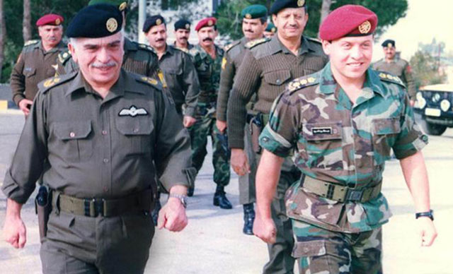 His Majesty the late King Hussein with His Majesty King Abdullah (then Prince Abdullah) during a military ceremony (Petra file photo)