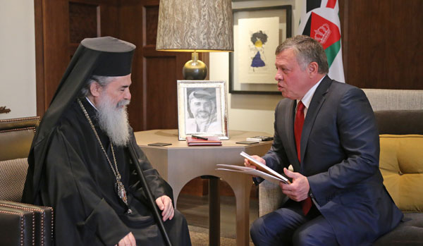 His Majesty King Abdullah meets with Theophilos III, patriarch of the Holy City of Jerusalem and all Palestine and Jordan, in Amman, on Sunday  (Photo courtesy of Royal Court)